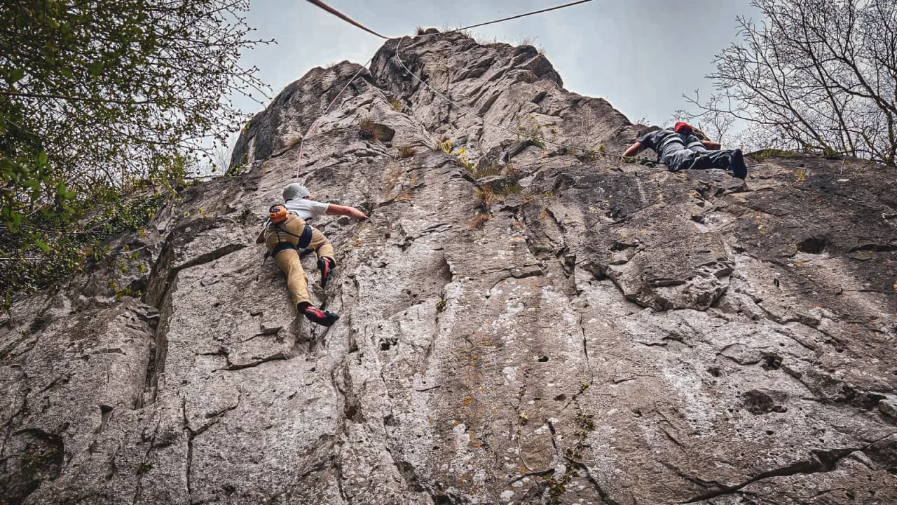 Cliff climbing at Yvoir, Belgium: climbers tackle an impressive rock face.