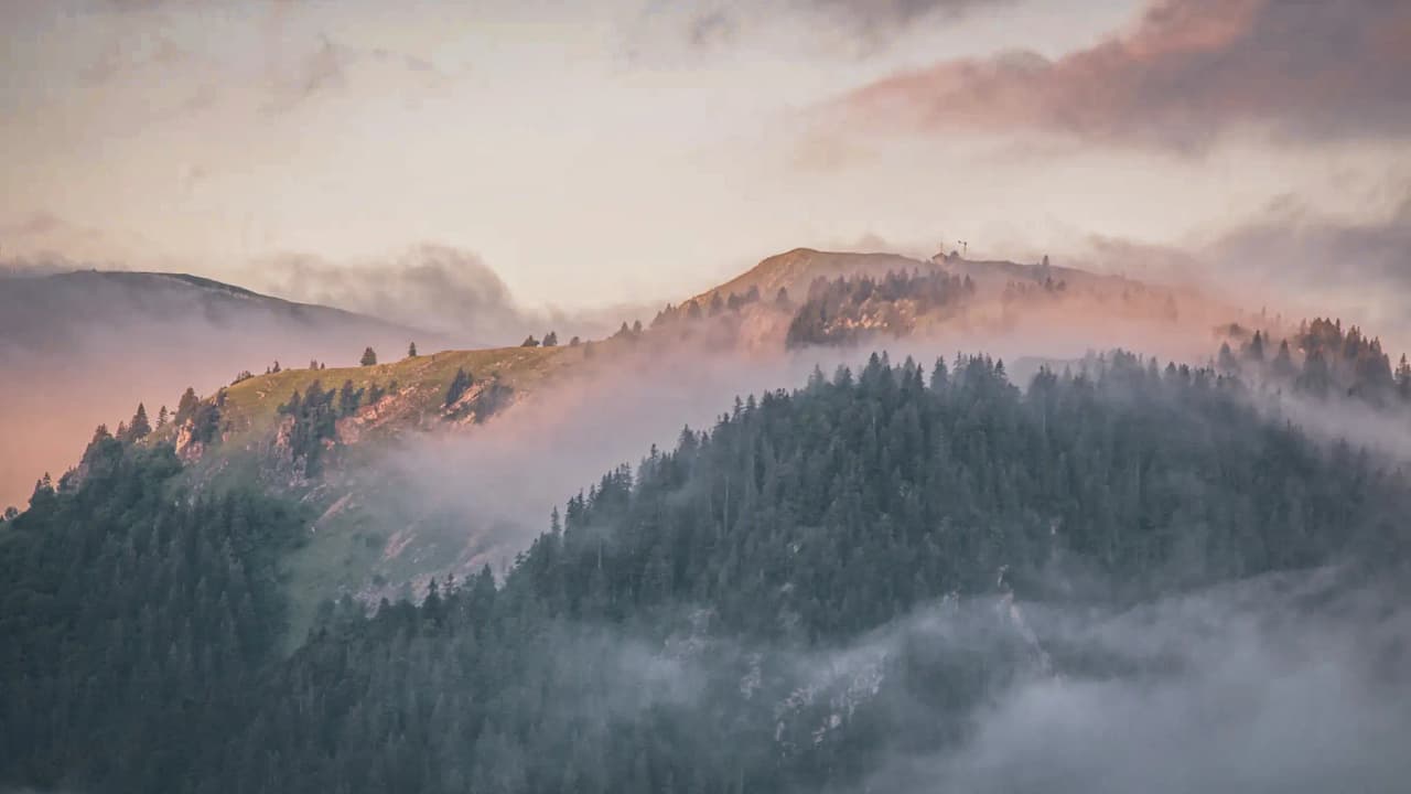 Mystical mountain scenery at dawn, misty and inviting, inviting you to venture into the Jura.