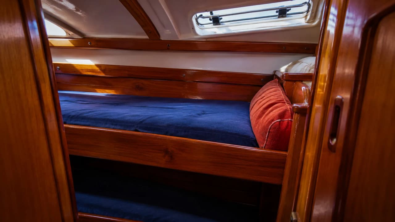 A cosy cabin on a sailing boat, perfect for unwinding after an adventure at sea.