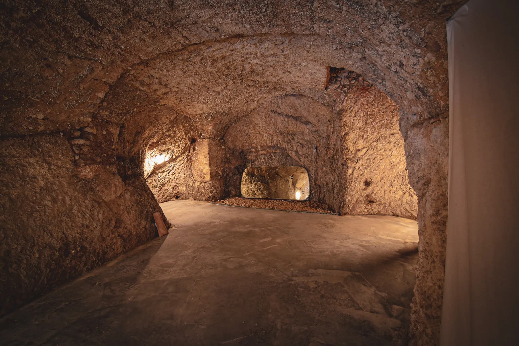 A unique stone space, delicately lit, inviting you to meditate and relax.