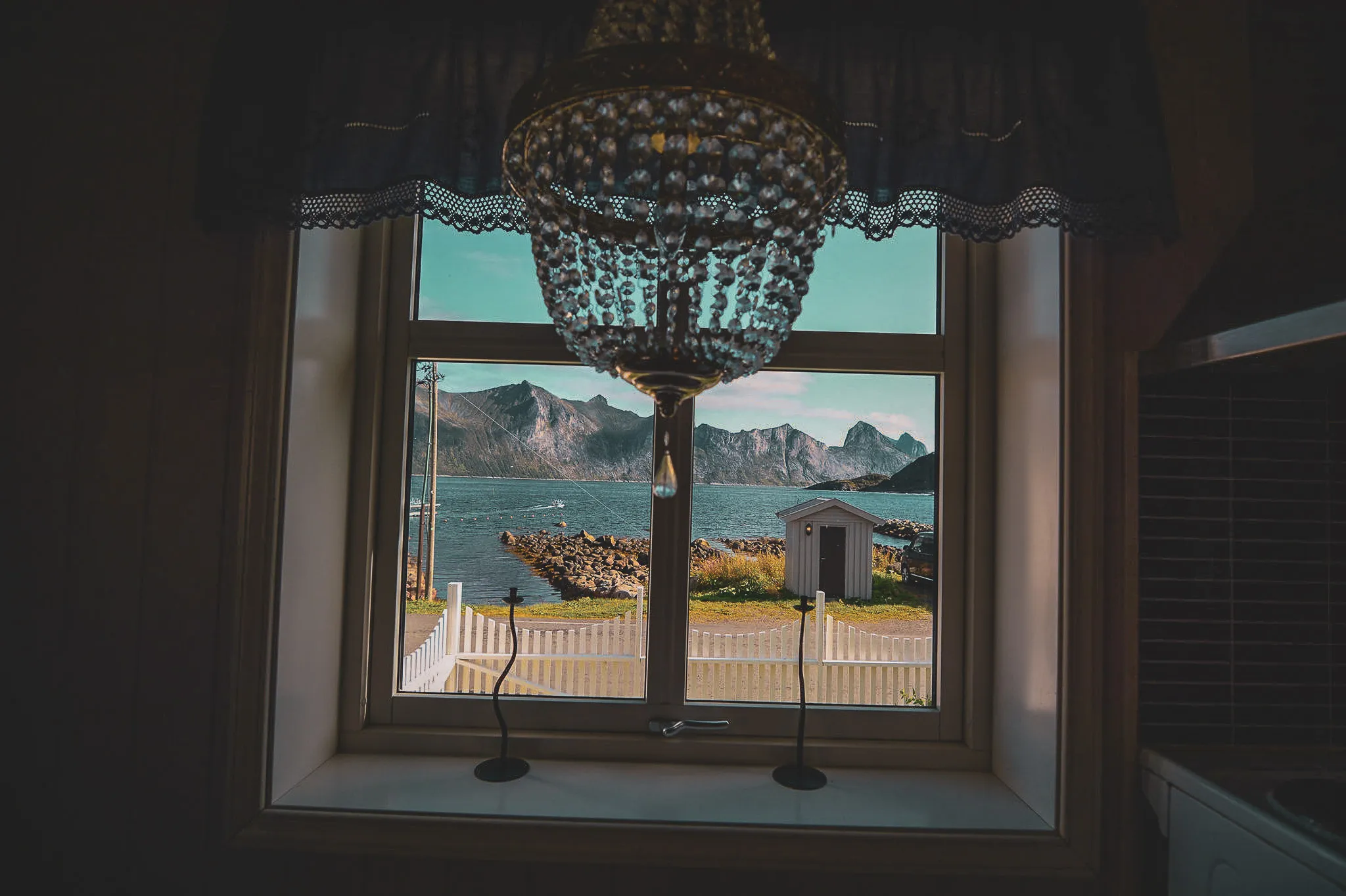Captivating views over a fjord, with majestic mountains and welcoming light.
