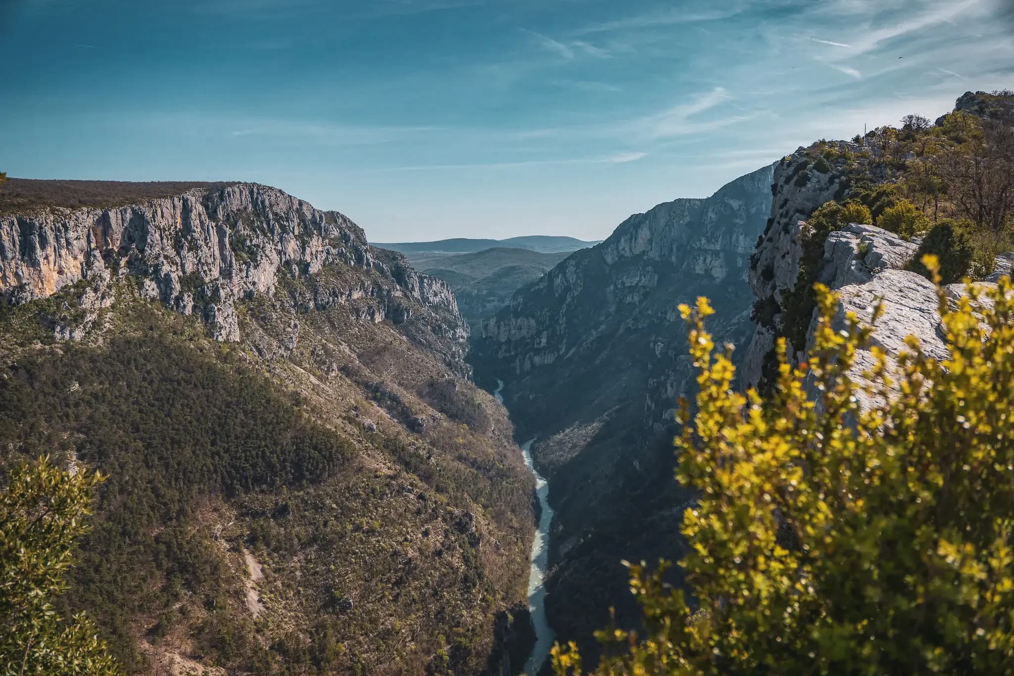 Panoramic view of the Gorges du Verdon, with majestic cliffs and clear skies.