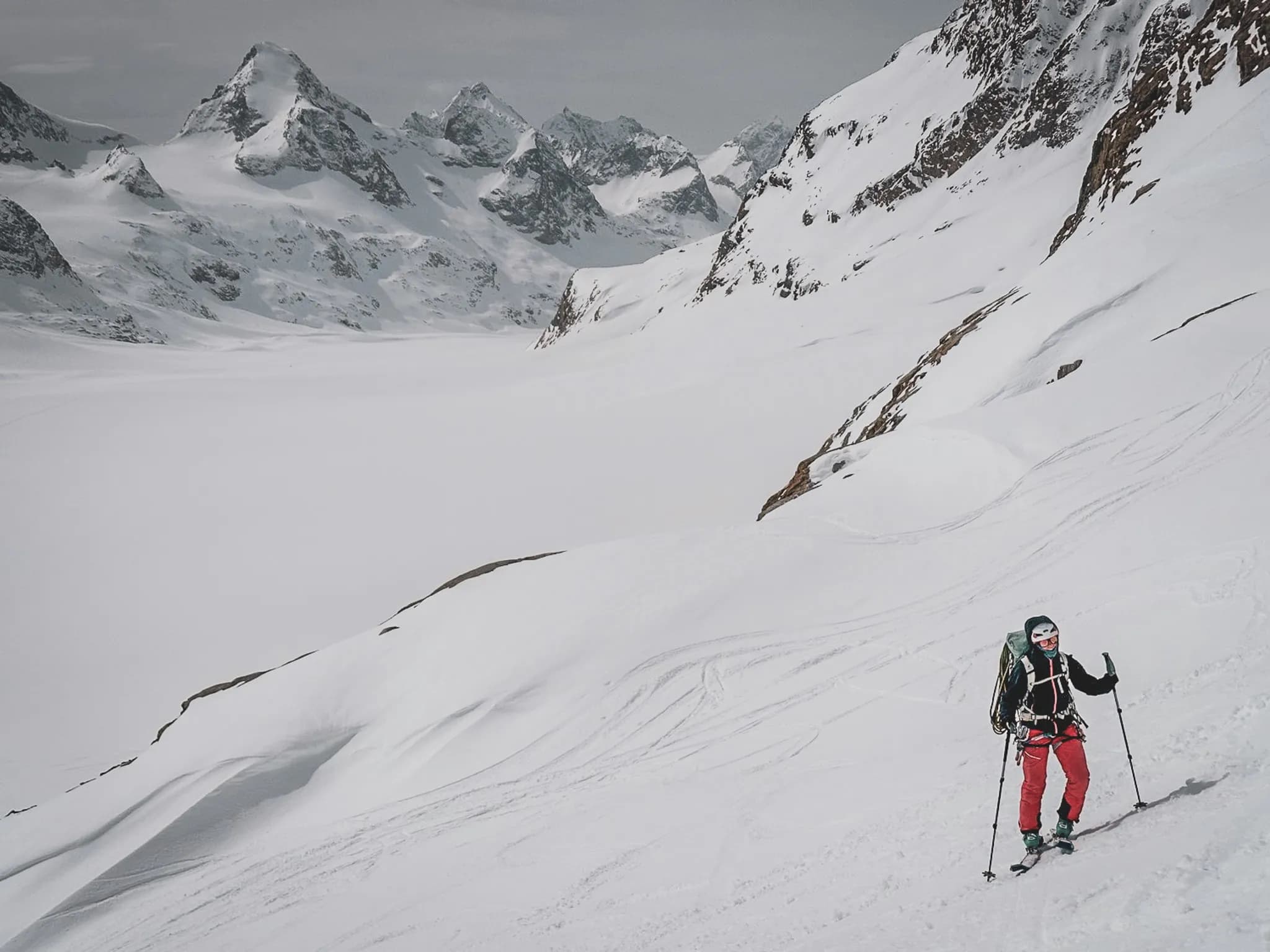 A skier in full effort on the Chamonix-Zermatt Haute Route.
