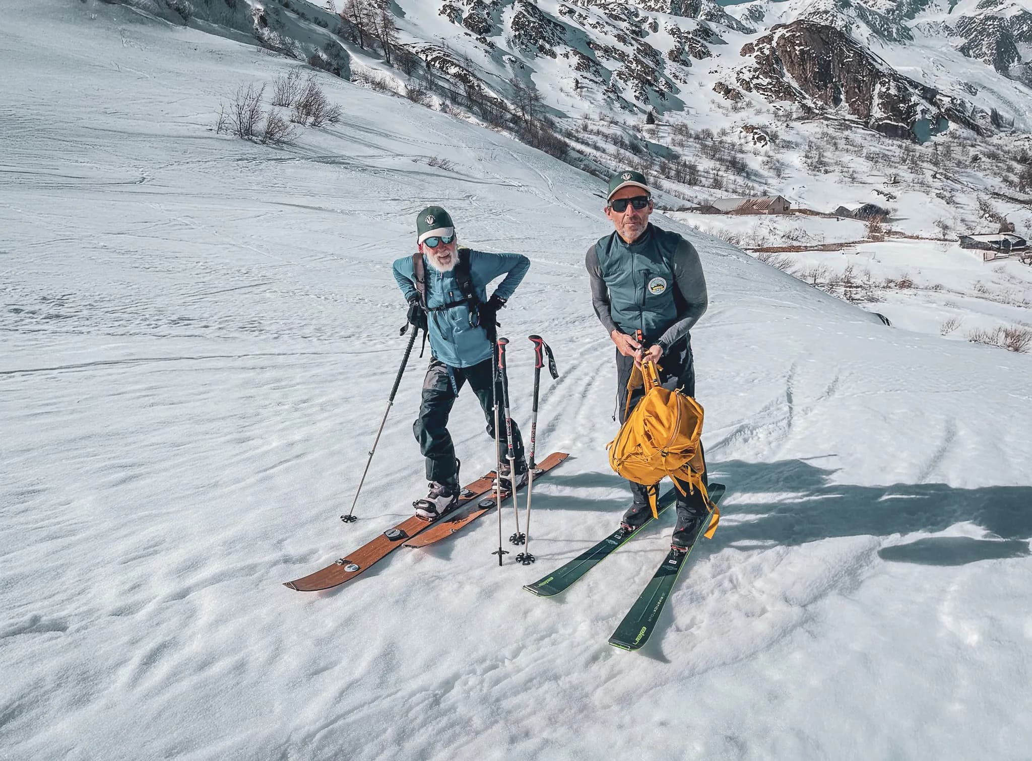 Two skiers on an expedition over the Great St Bernard Pass, surrounded by sparkling snow.