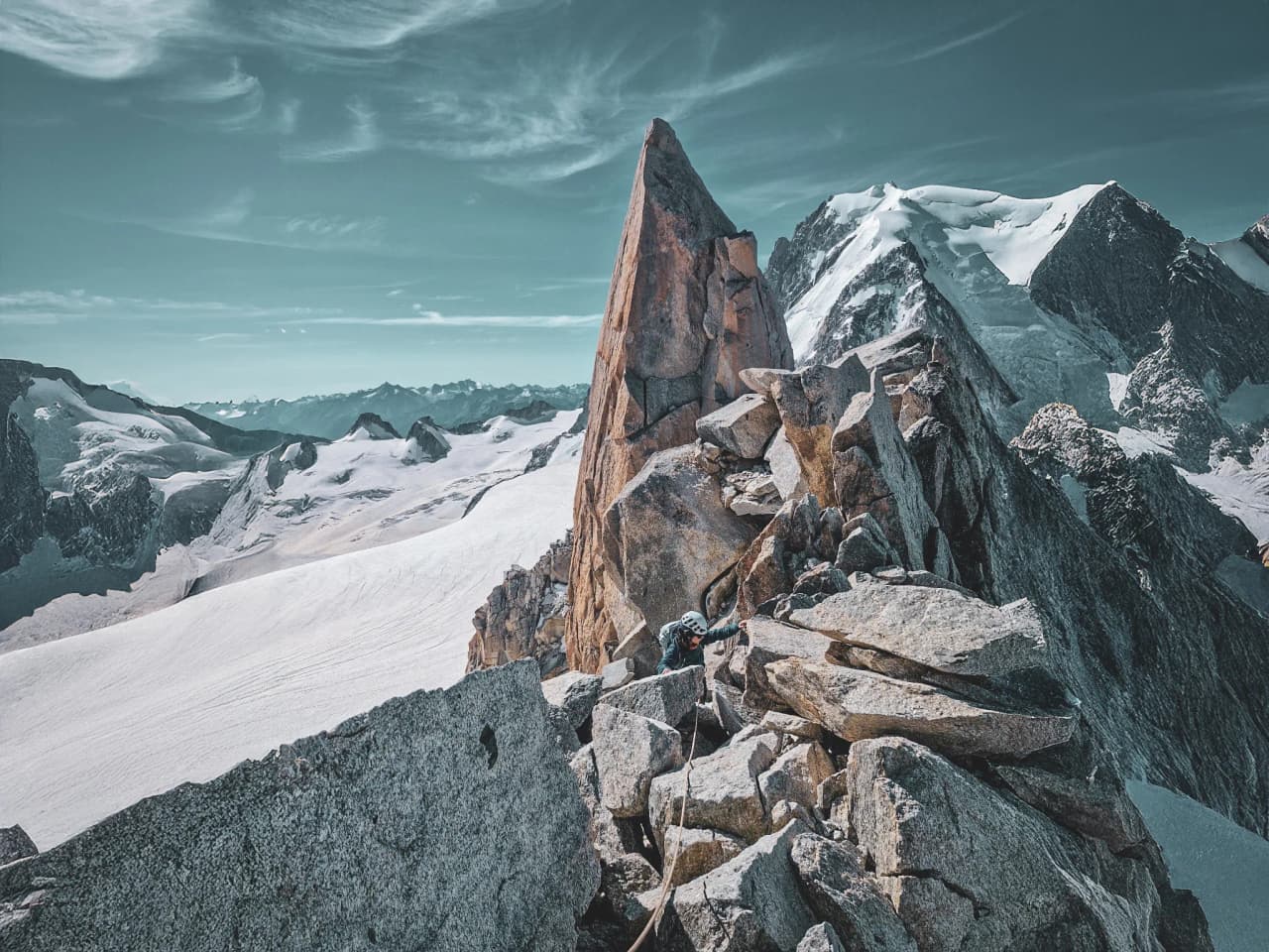 The majestic granite spires of Mont Blanc under an azure sky
