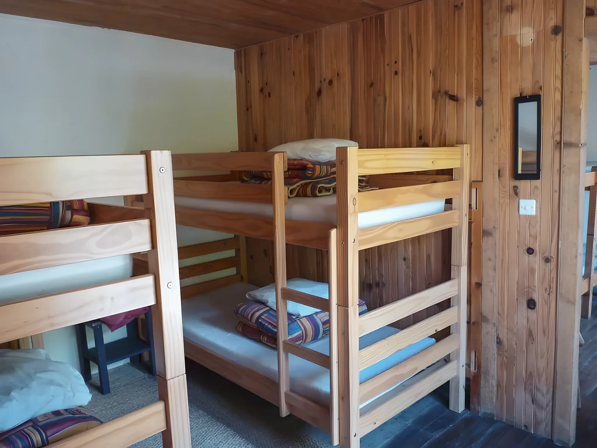 Wooden rooms with bunk beds, perfect for an alpine adventure in Ubaye.