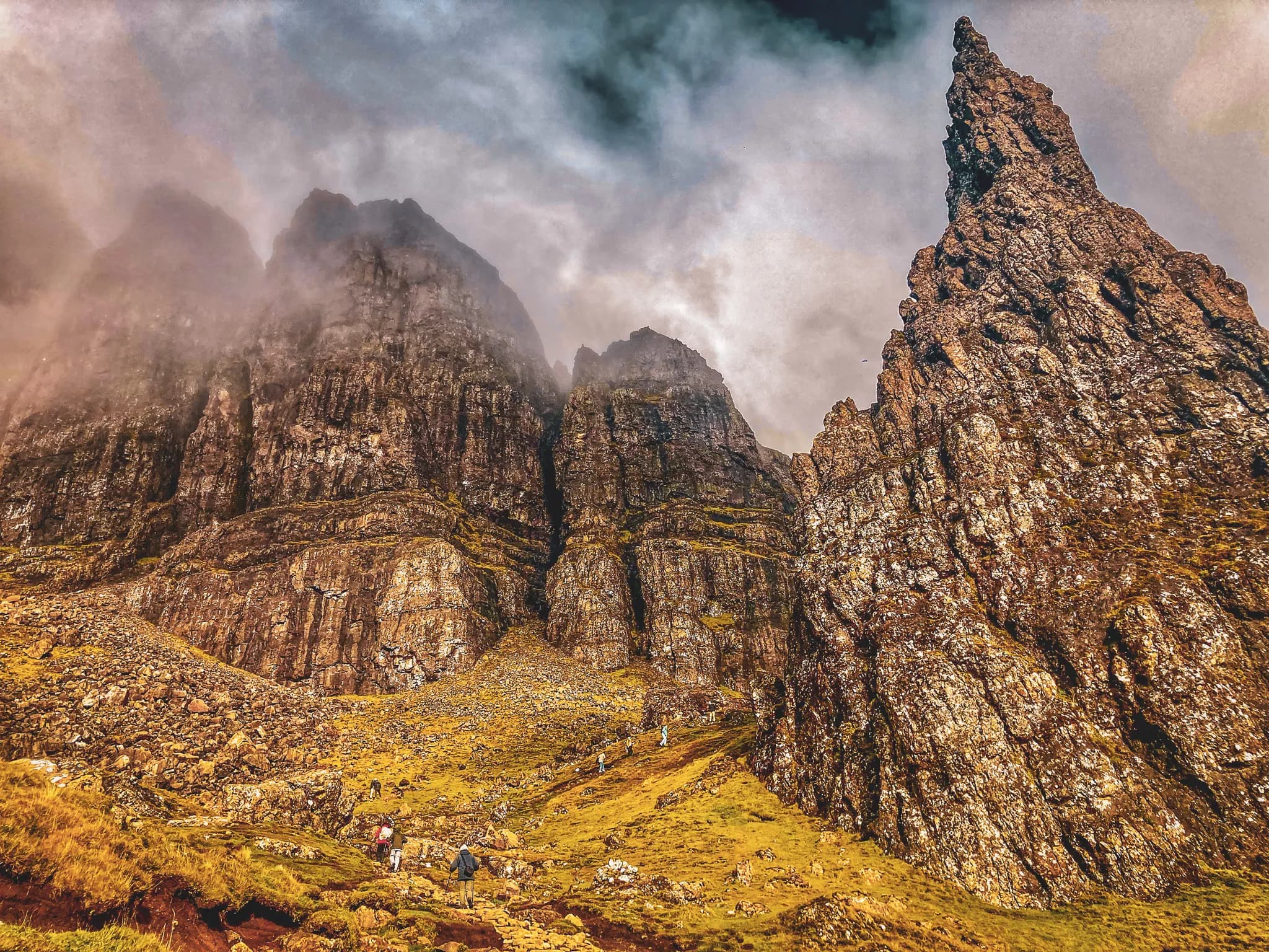 The majestic mountainous landscape of the Isle of Skye, shrouded in mist and inviting adventure.
