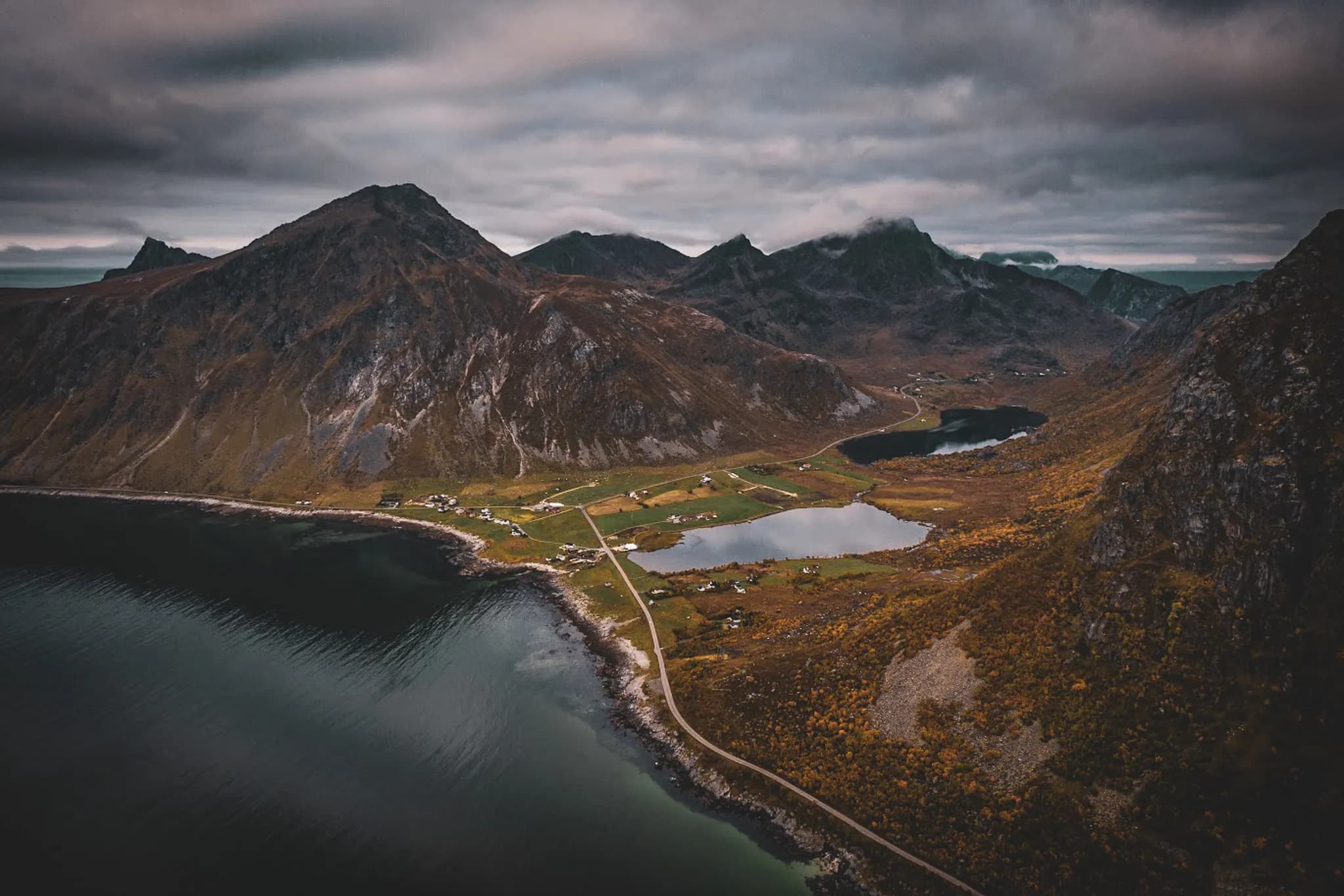 Panoramic views over the fjords and colourful mountains of Senja Island, Norway.