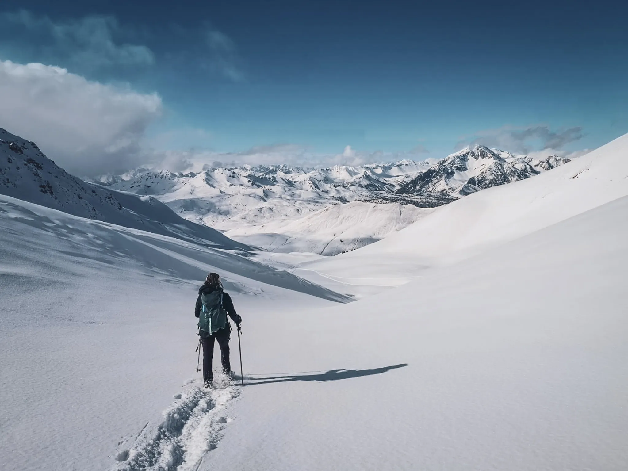 A soothing walk in a majestic, snowy Alpine landscape, inviting you to explore.
