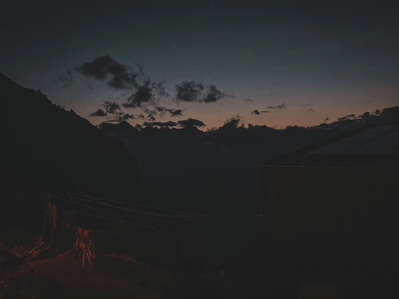 Vibrant sunset over the Dolomite mountains, a peaceful, mountainous atmosphere.