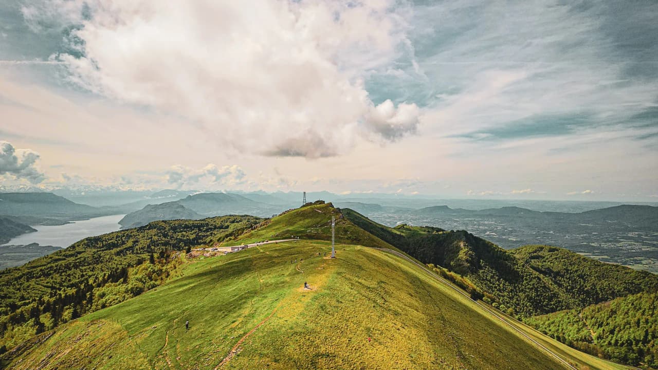 Panoramic view of the Jura massif, green and sunny, overlooking Lac du Bourget.
