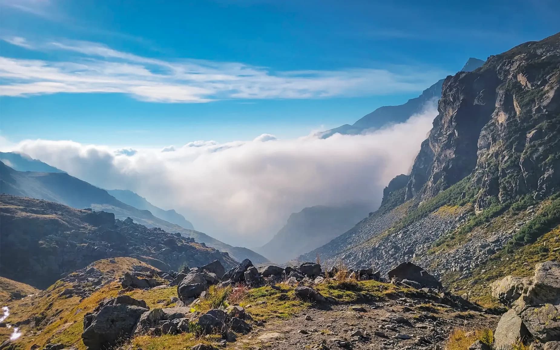 The panoramic view of the cloud-covered mountains is breathtaking.