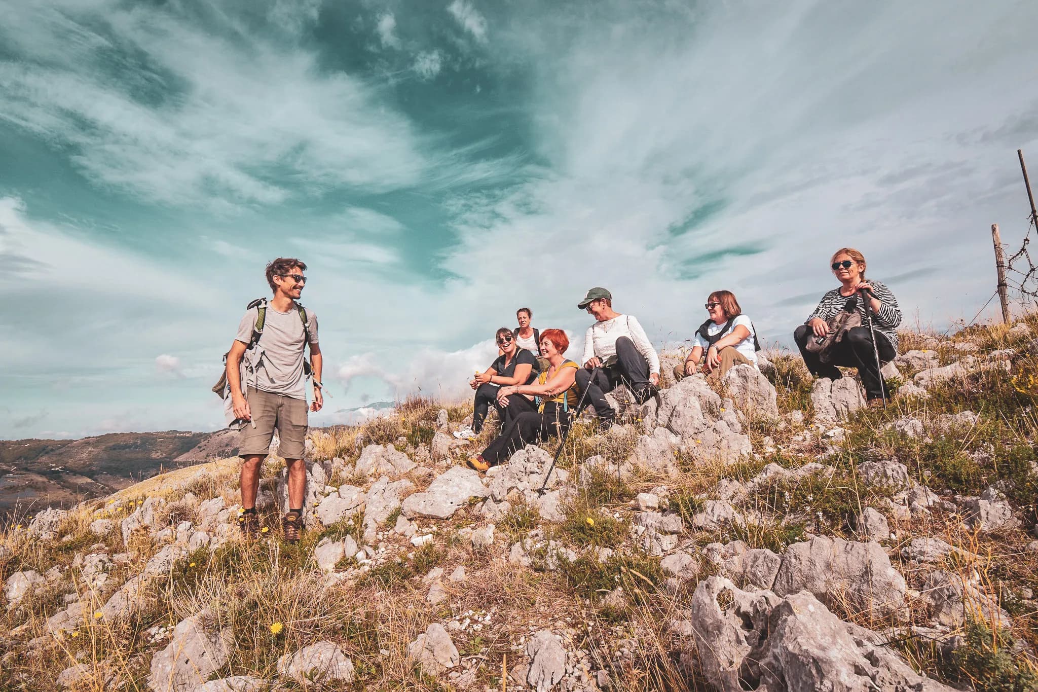 A group of happy hikers enjoying the spectacular scenery of the Valle di Comino.