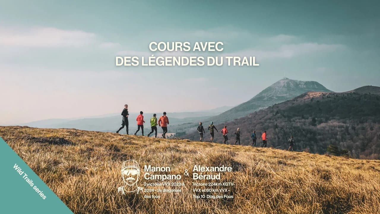A group of athletes out in the great outdoors, on the volcanic trails of the Auvergne, under clear skies.