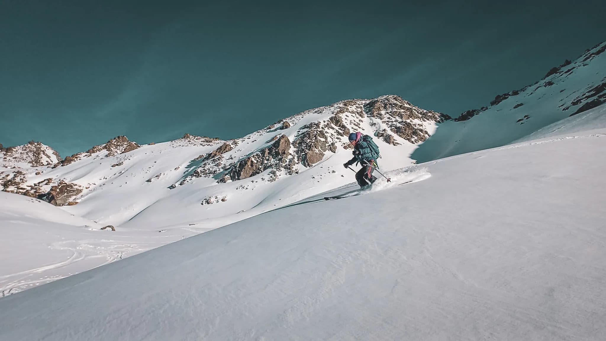 A skier descends the Rosablanche during a crossing on the Haute Route from Chamonix to Zermatt