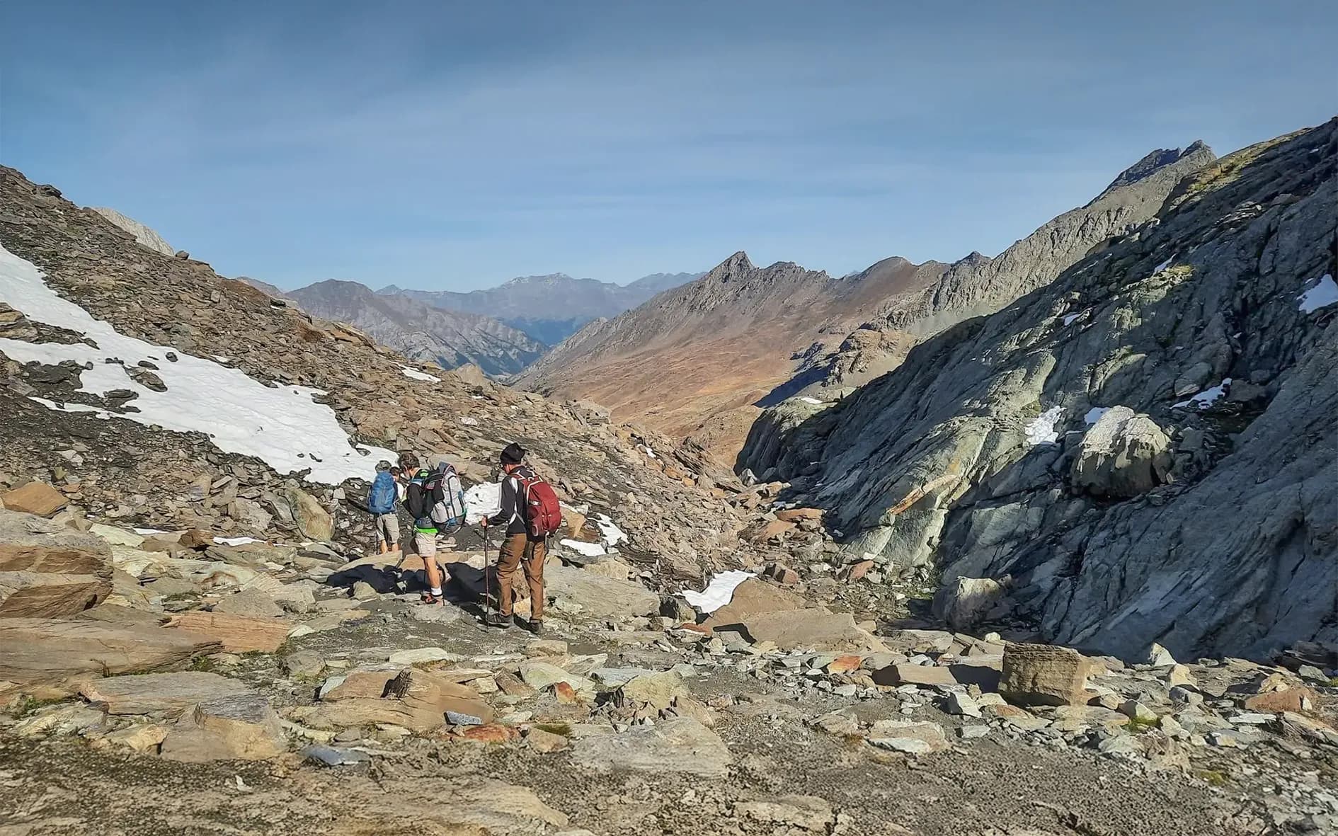 Hiking in the heart of the Alps, with breathtaking mountain panoramas and determined hikers.