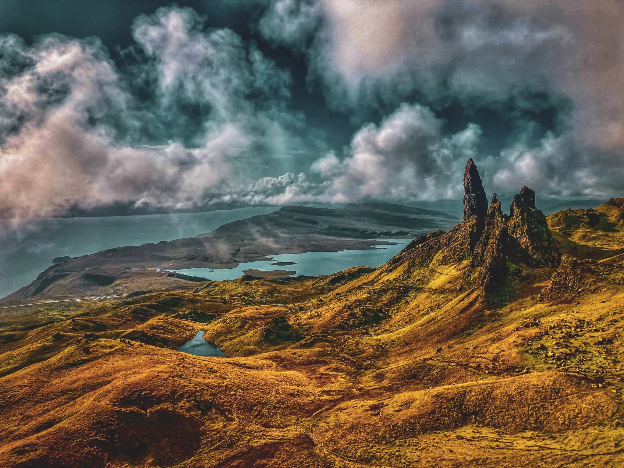 The breathtaking scenery of the Isle of Skye, with its majestic cliffs and sparkling lakes.