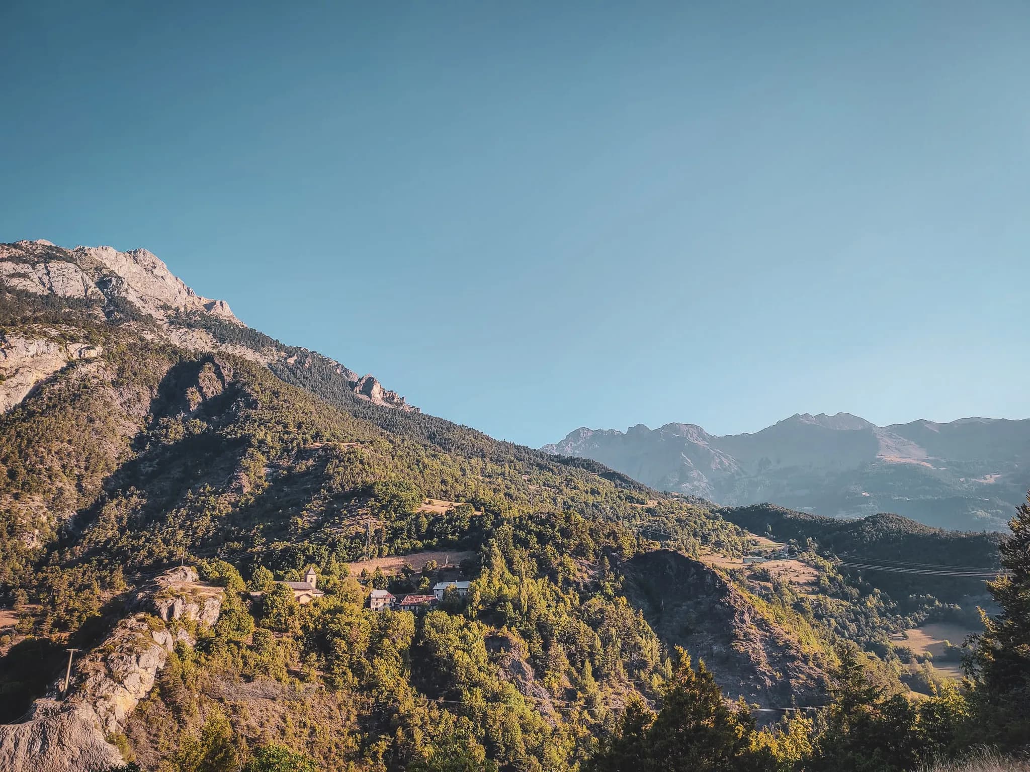 Majestic Alpine scenery with mountains, green valleys and picturesque villages.