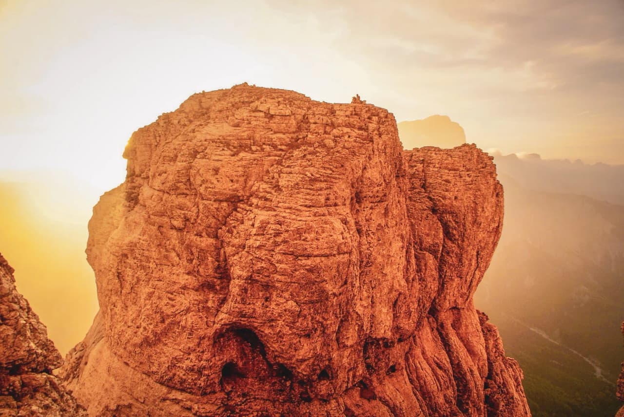 Spectacular panorama of Mont Aiguille, between clouds and majestic rocks. An adventure not to be missed!
