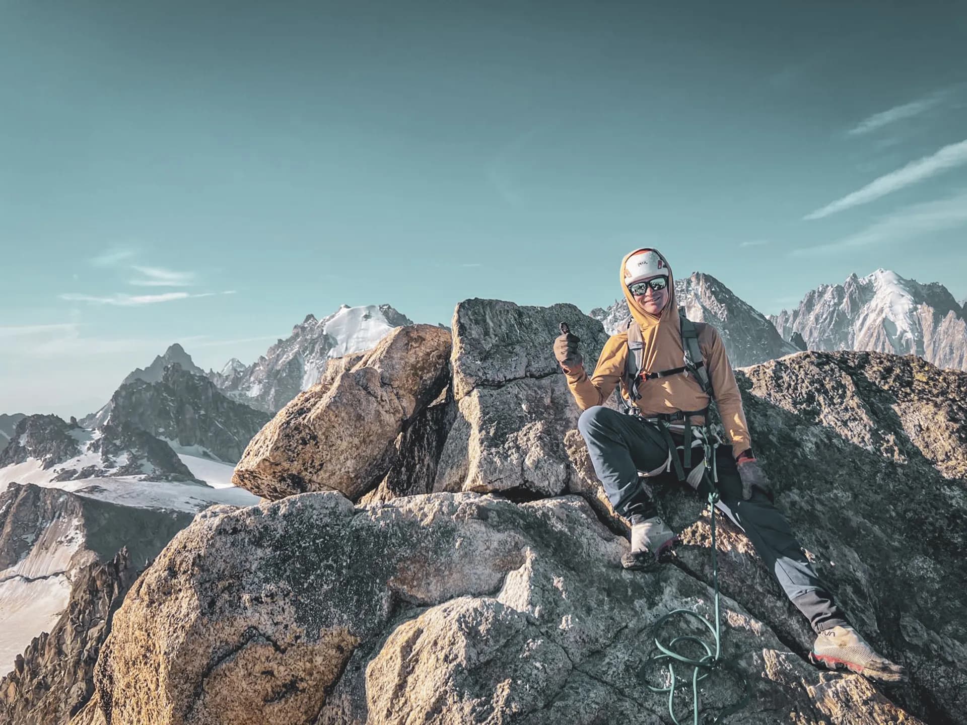 climbing a rocky peak, majestic mountain panorama.