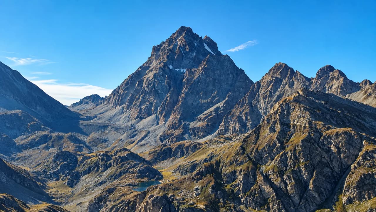 The majestic Mount Viso against a brilliant blue sky – an invitation to an alpine adventure.