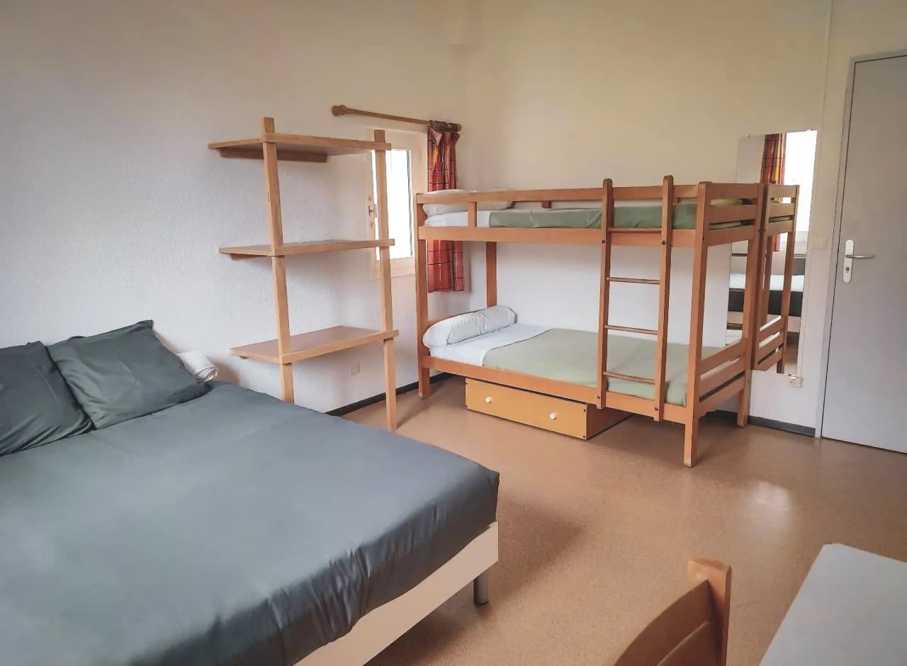 Cosy room with bunk beds, perfect for resting after climbing.