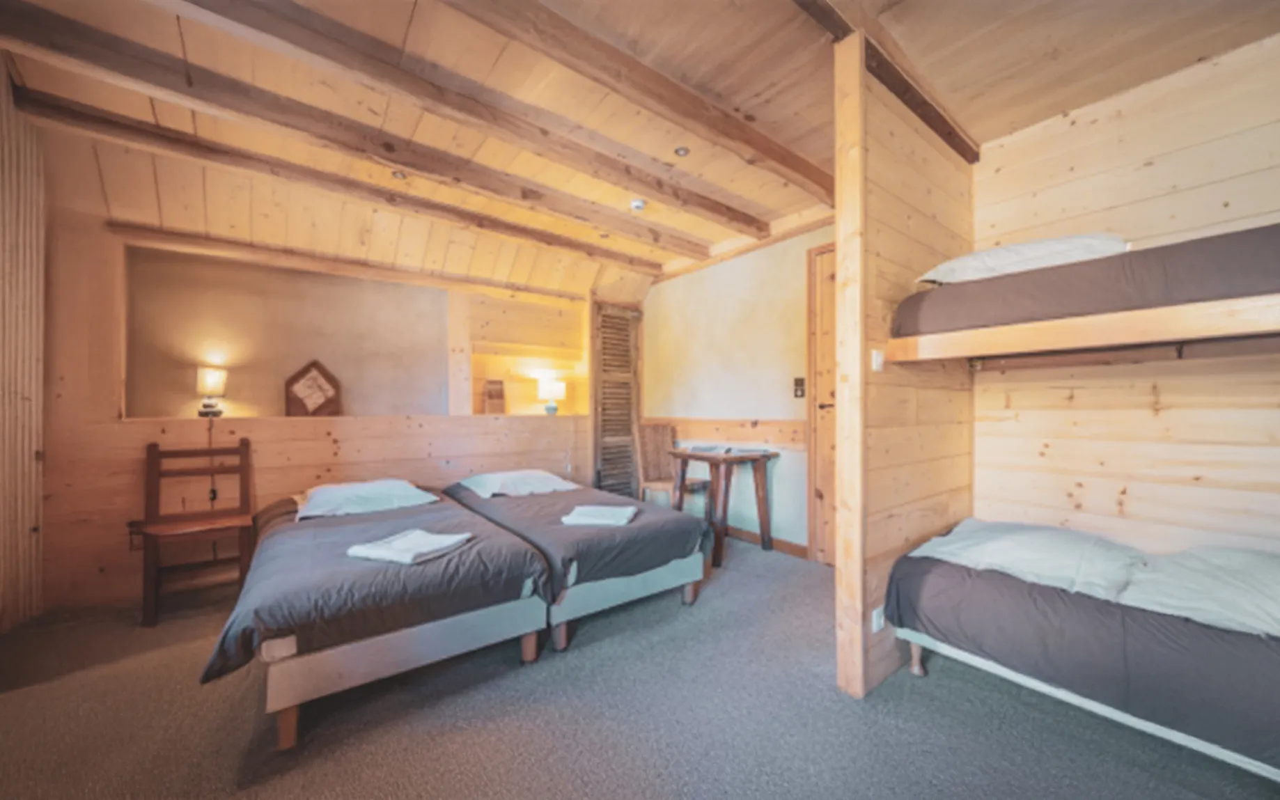 A friendly wooden room with modern comforts to recharge your batteries after a day's expedition.