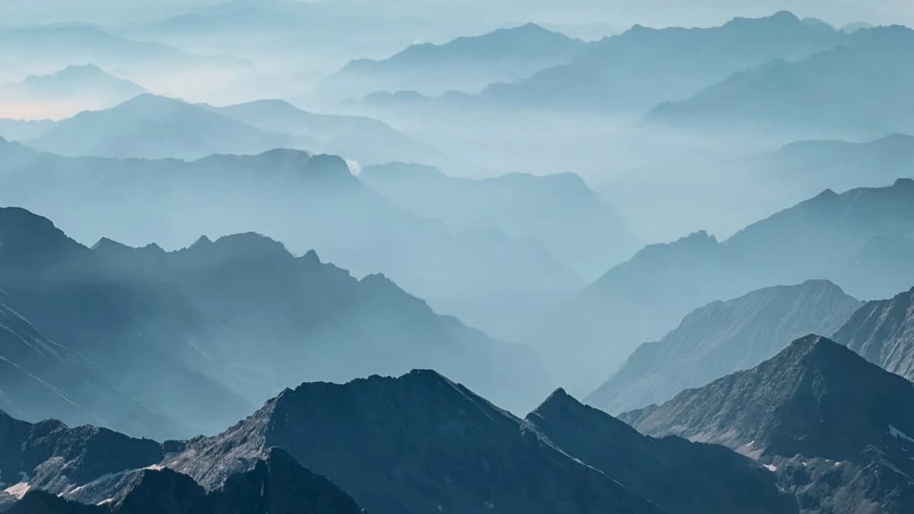 Misty mountain ranges: an invitation to adventure in the Monte Rosa massif.