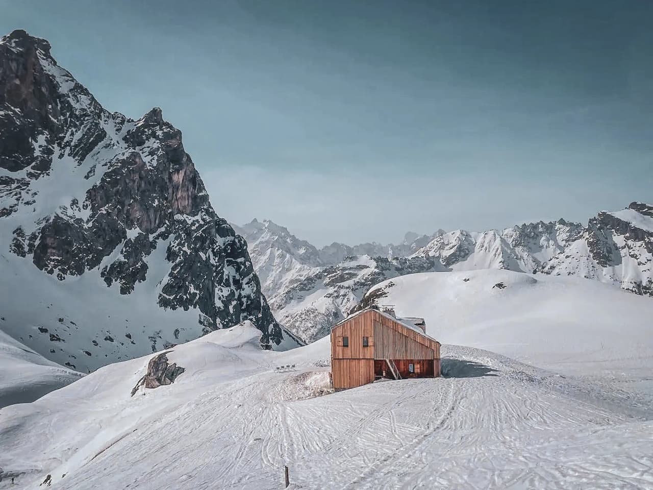 A cosy Mountain hut surrounded by majestic mountains and immaculate snow. The perfect winter escape.
