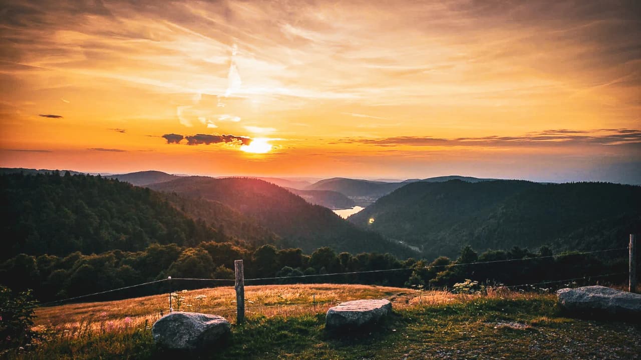 Sunset over the crests of the Vosges mountains, soothing panoramic views and stunning natural scenery.