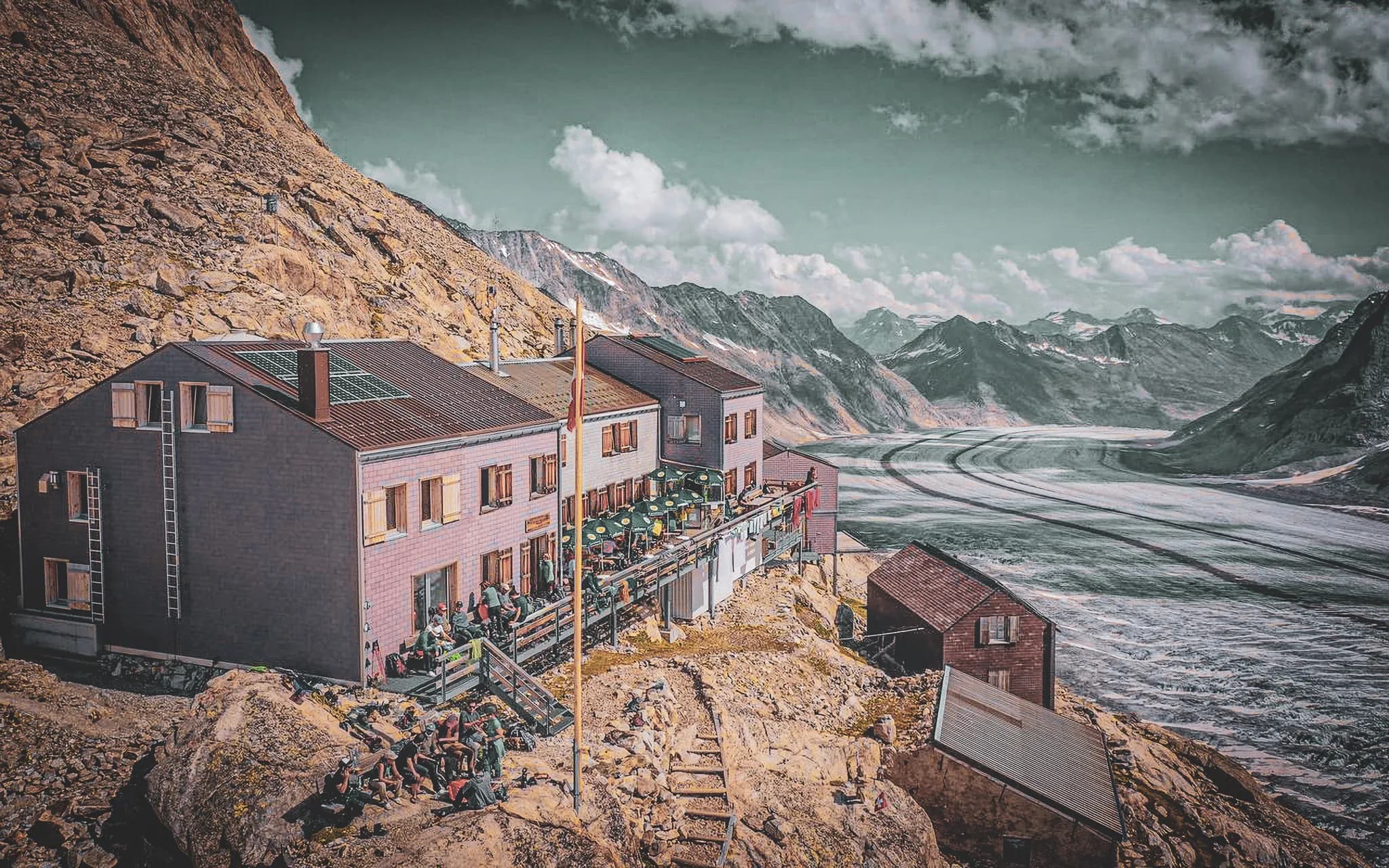 Alpine Mountain hut overlooking the Aletsch glacier, with a warm atmosphere and majestic panoramas.