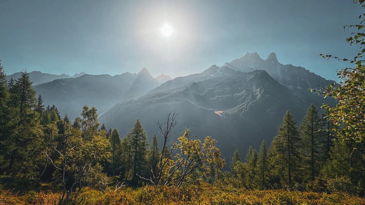 Majestic mountains in brilliant sunshine, a wild landscape inviting adventure.