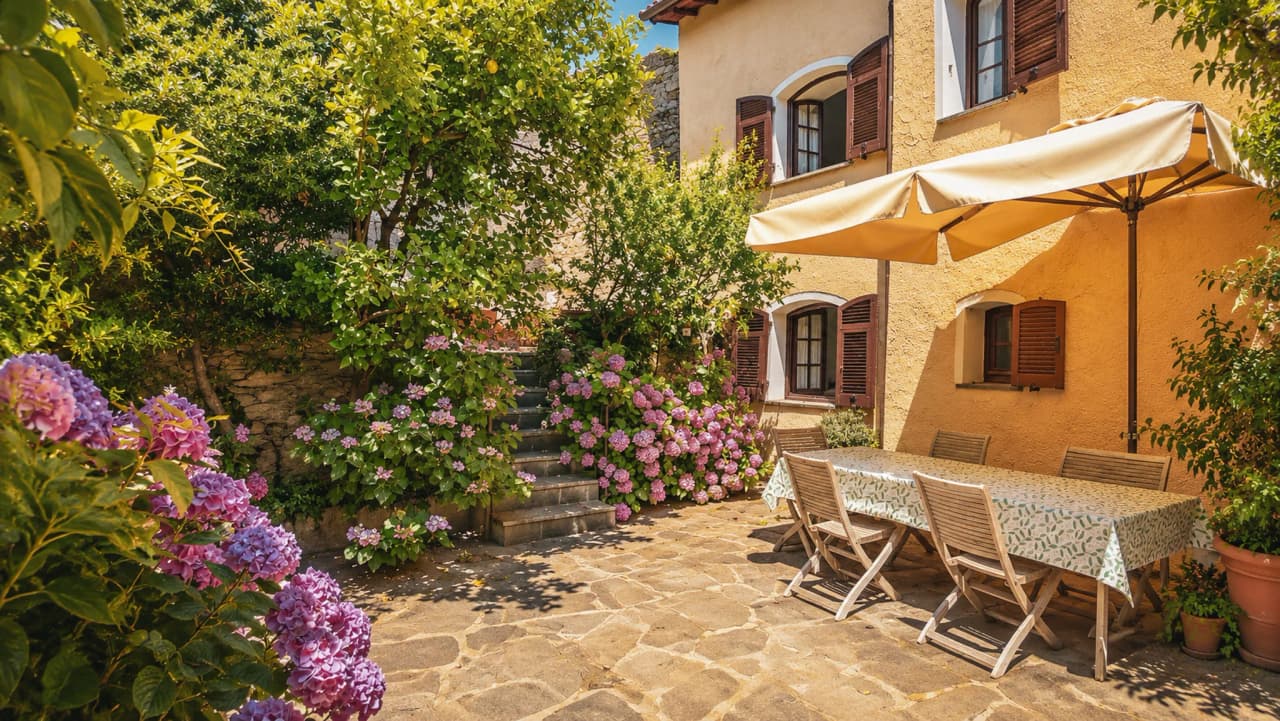 A lovely, sunny patio with colourful flowers, perfect for relaxing after a climb.