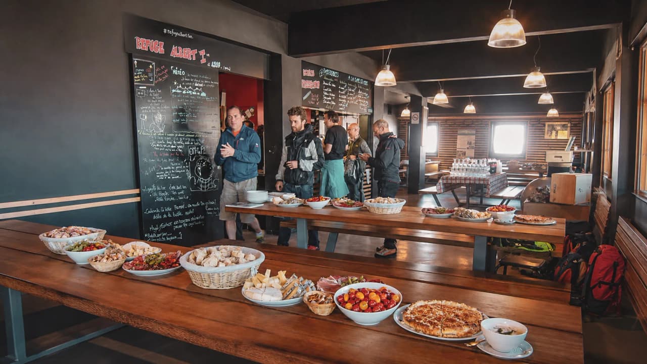 A cosy alpine Mountain hut with a variety of dishes, perfect for a bite to eat after an adventure.
