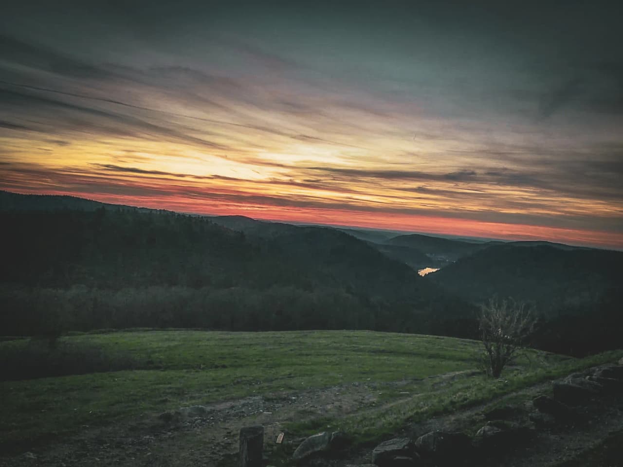 A colourful sunset over the green valleys of the Vosges, an invitation to escape.