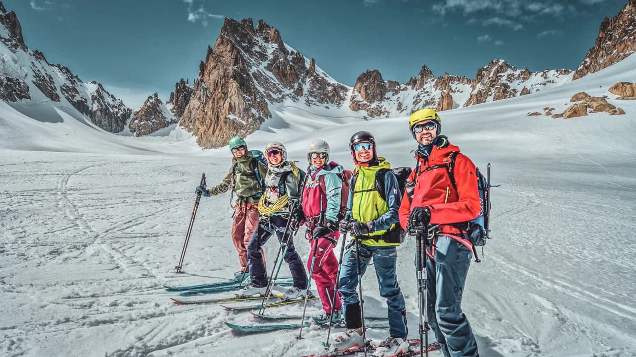A wooden Mountain hut at the summit of snow-capped mountains, surrounded by majestic glaciers. An alpine escape!