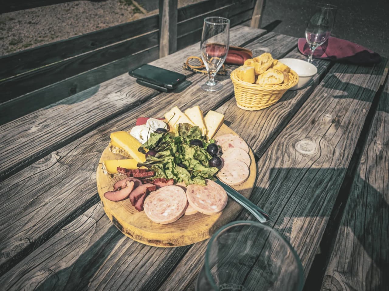 A platter of cold meats, cheeses and salad for a convivial meal outdoors in the Vosges.