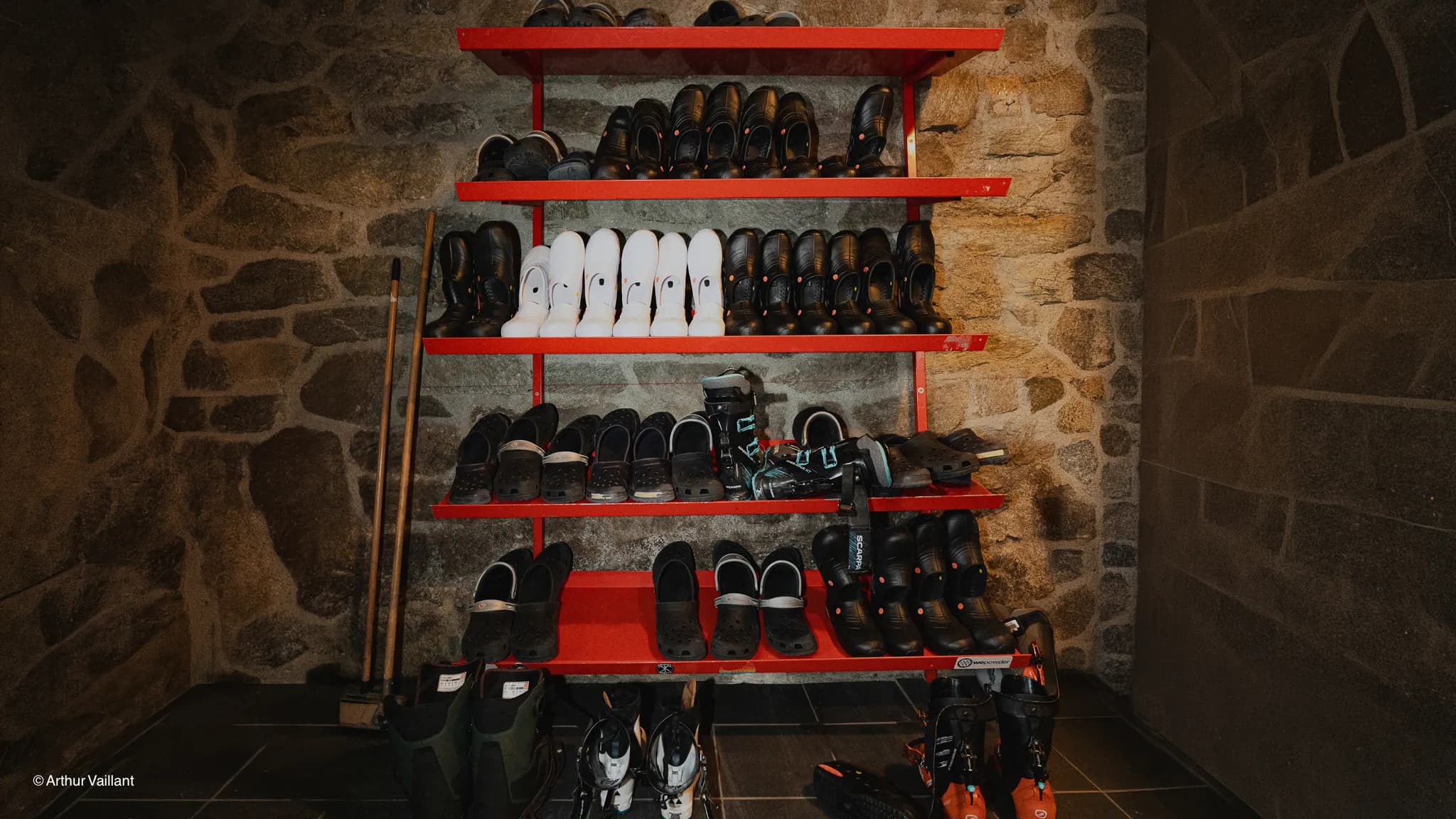 Colourful shelves displaying hiking and ski boots, ready for an alpine adventure.