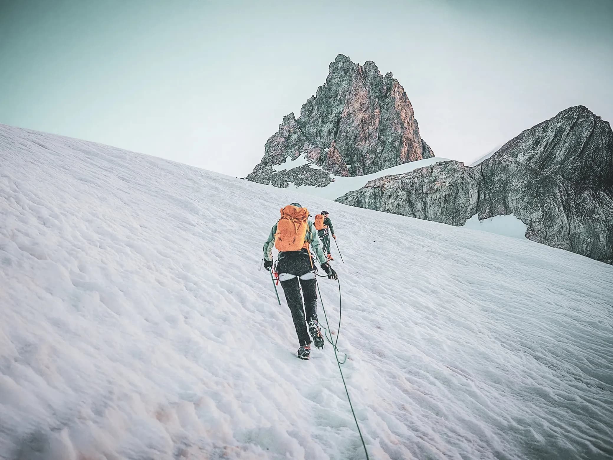 Mountaineers on a glacier between majestic peaks in Chamonix.