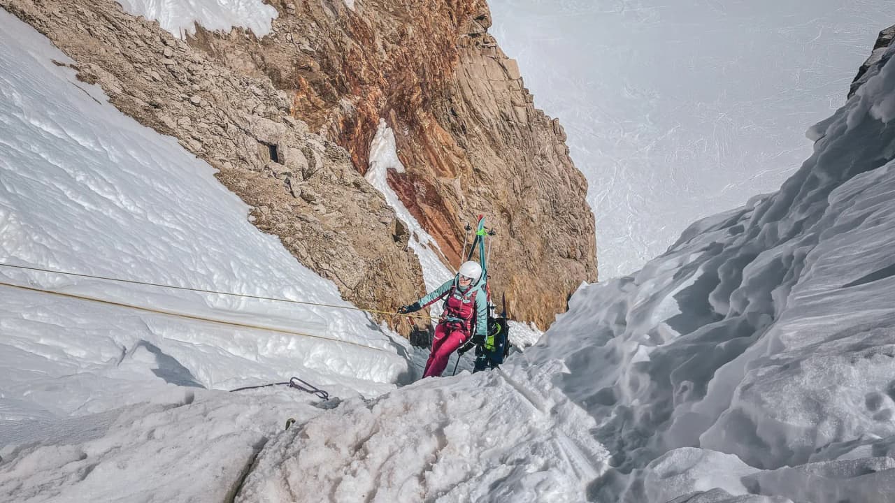 A climber in the midst of a spectacular glacial landscape in the Alps.