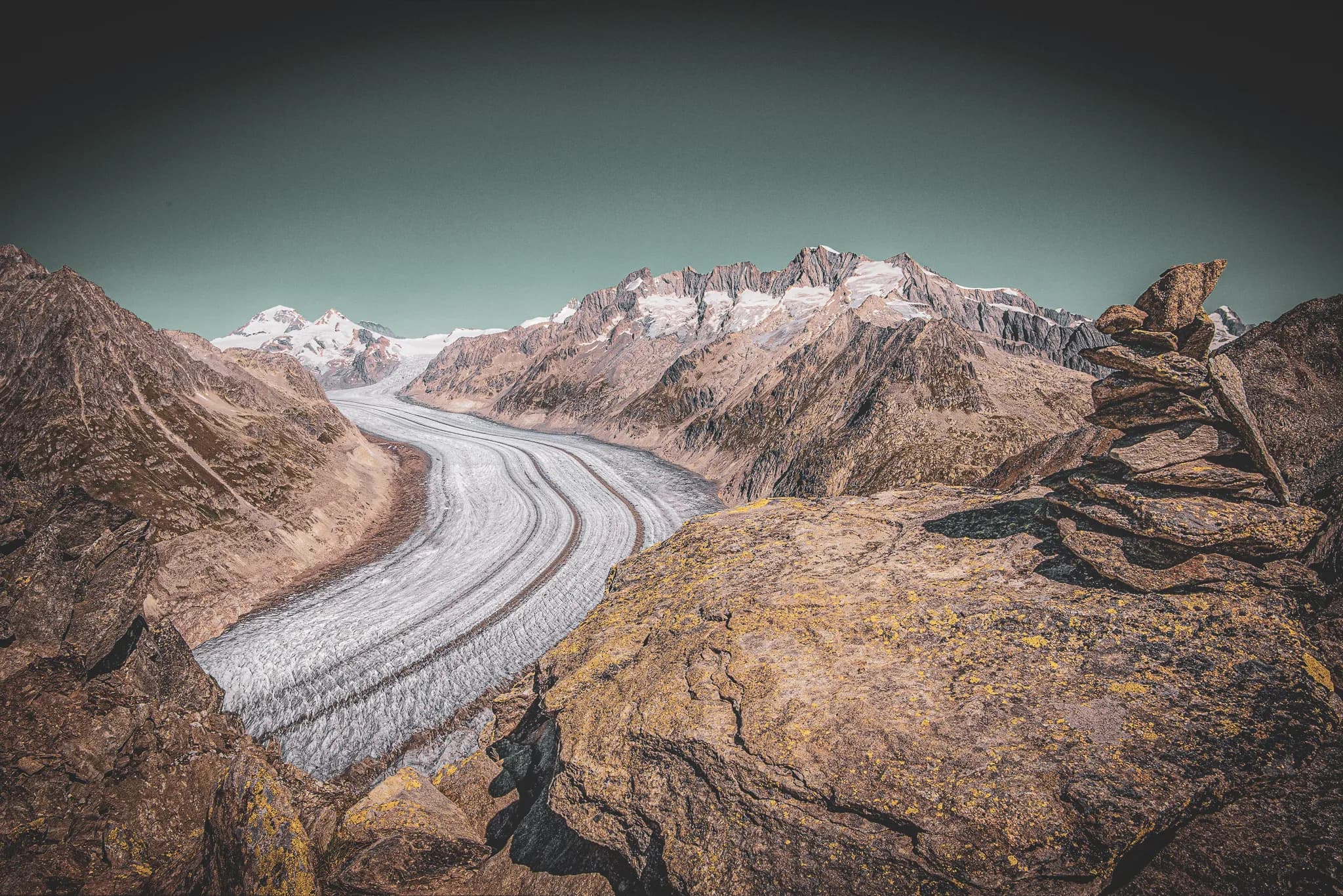 Spectacular panoramic views of the Aletsch glacier, surrounded by majestic Alpine mountains.
