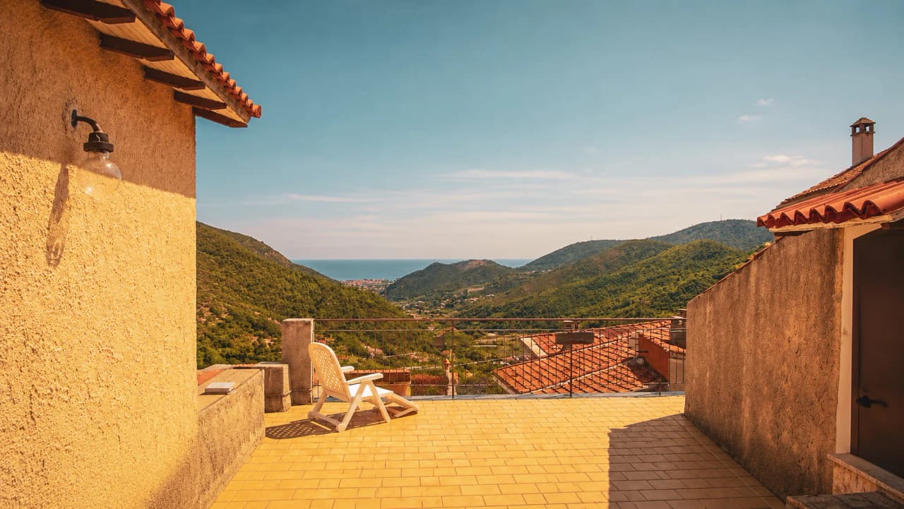 A sunny panoramic view of the lush green hills and the Mediterranean, perfect for relaxation.