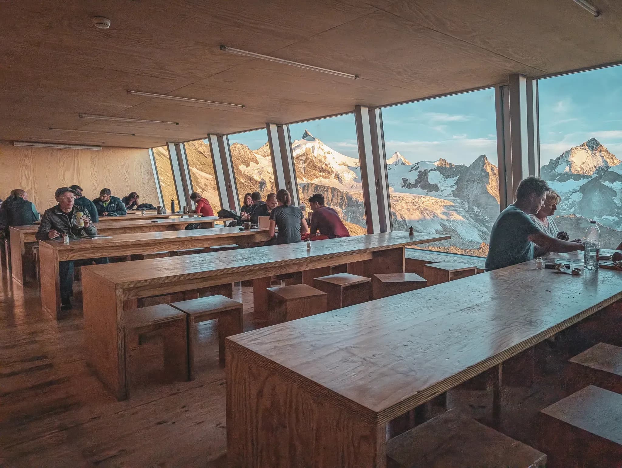 A welcoming room with a majestic view of the Alpine peaks and a warm, friendly atmosphere.