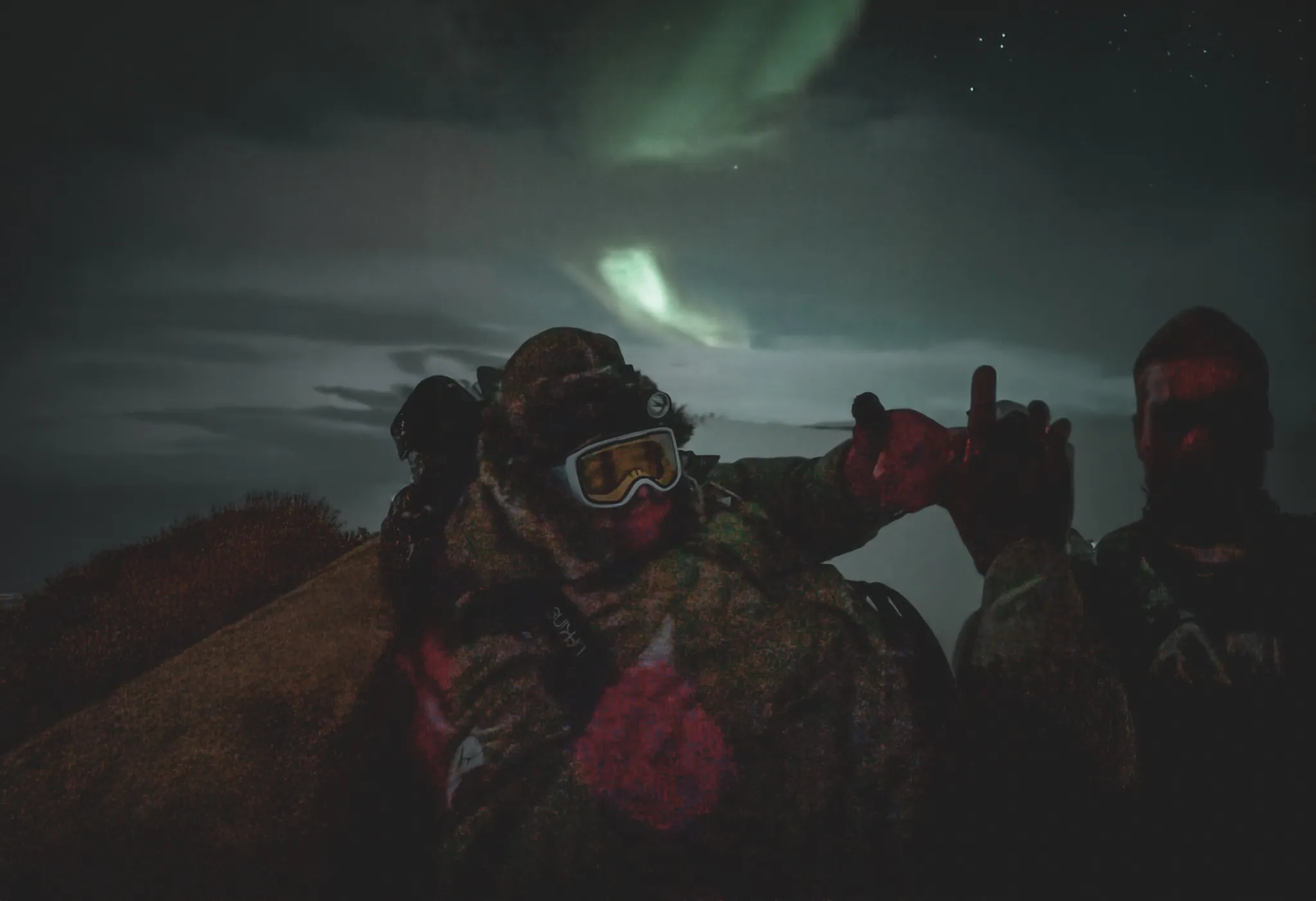 Two adventurers under the northern lights, ready to explore snowy Lapland.