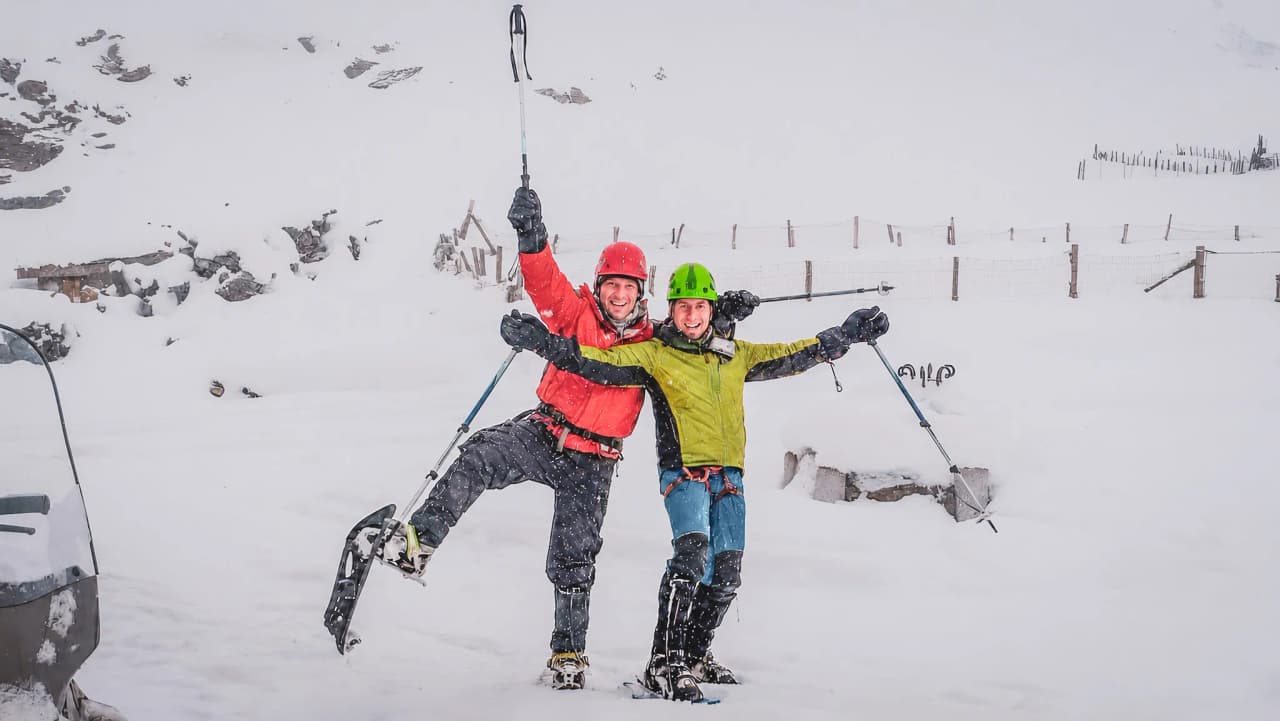 Two happy adventurers on a snowy expedition, ready to explore the Italian Alps.