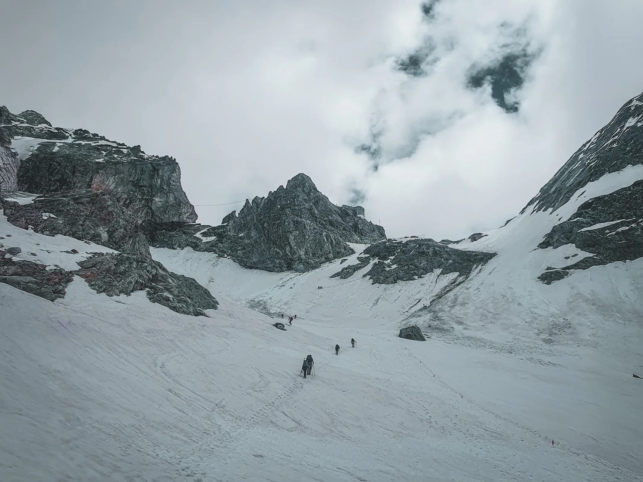 Glacier trails leading to majestic peaks, captivating alpine atmosphere.