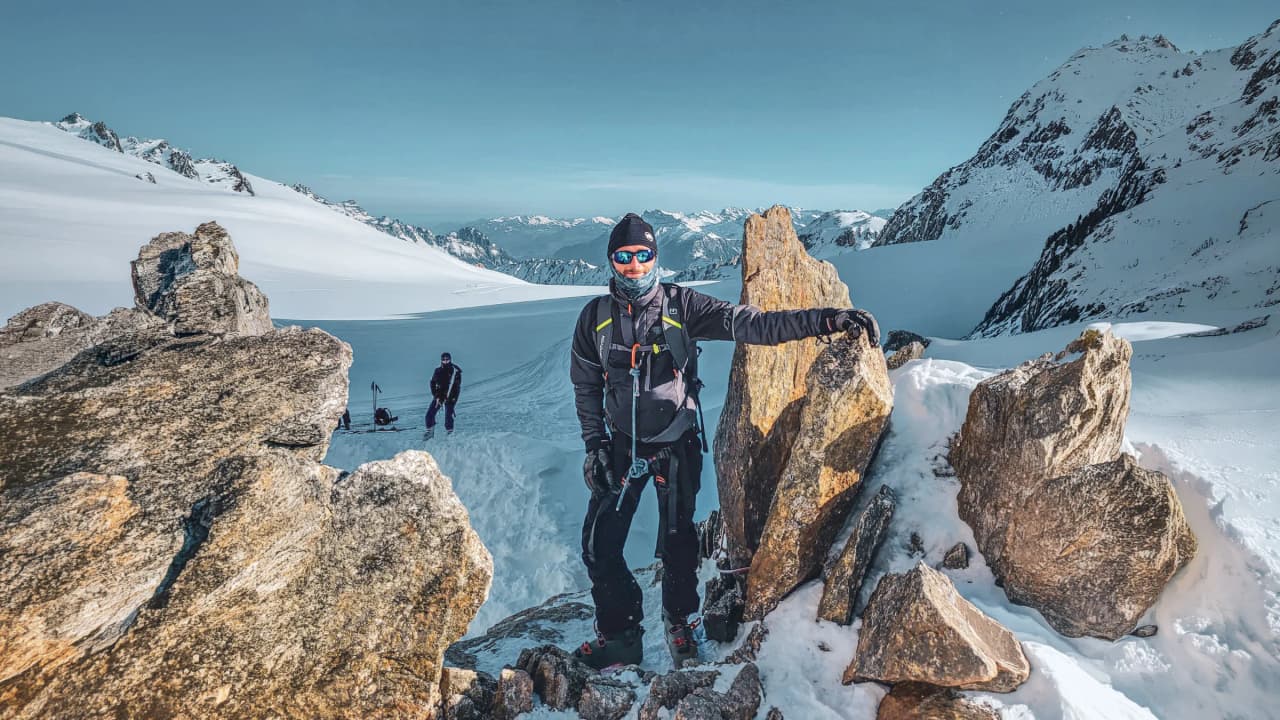 Hiking on a majestic glacier, surrounded by towering snow-capped mountains. Adventure guaranteed!