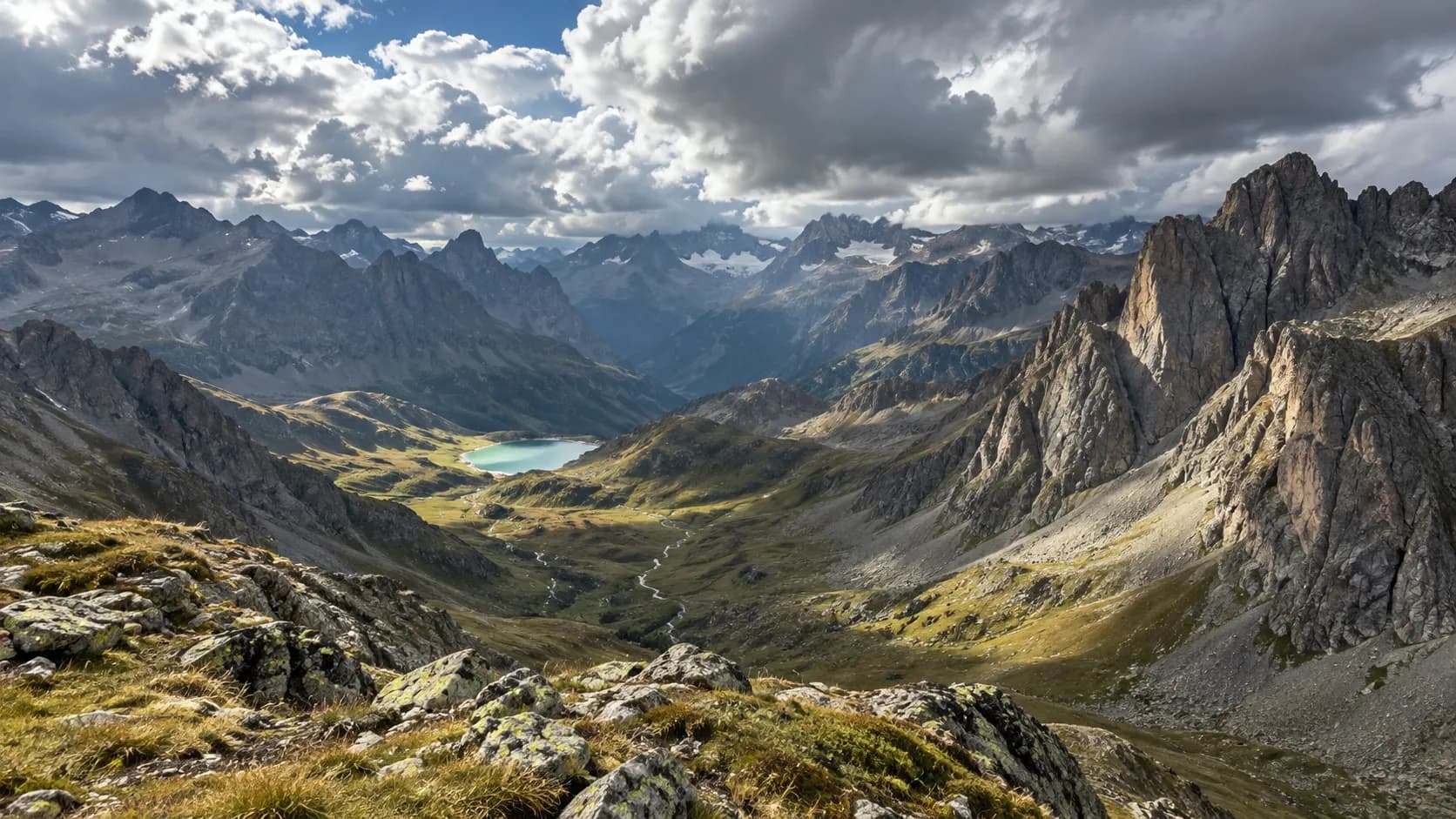 A spectacular view of the mountains and a high-altitude lake, inviting you to embark on an alpine adventure.