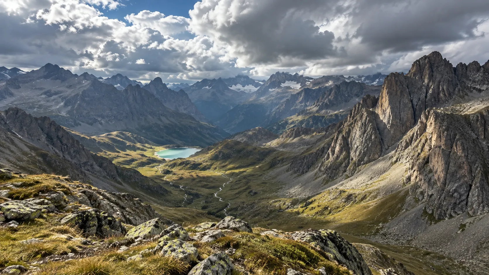 A spectacular view of the mountains and a high-altitude lake, inviting you to embark on an alpine adventure.