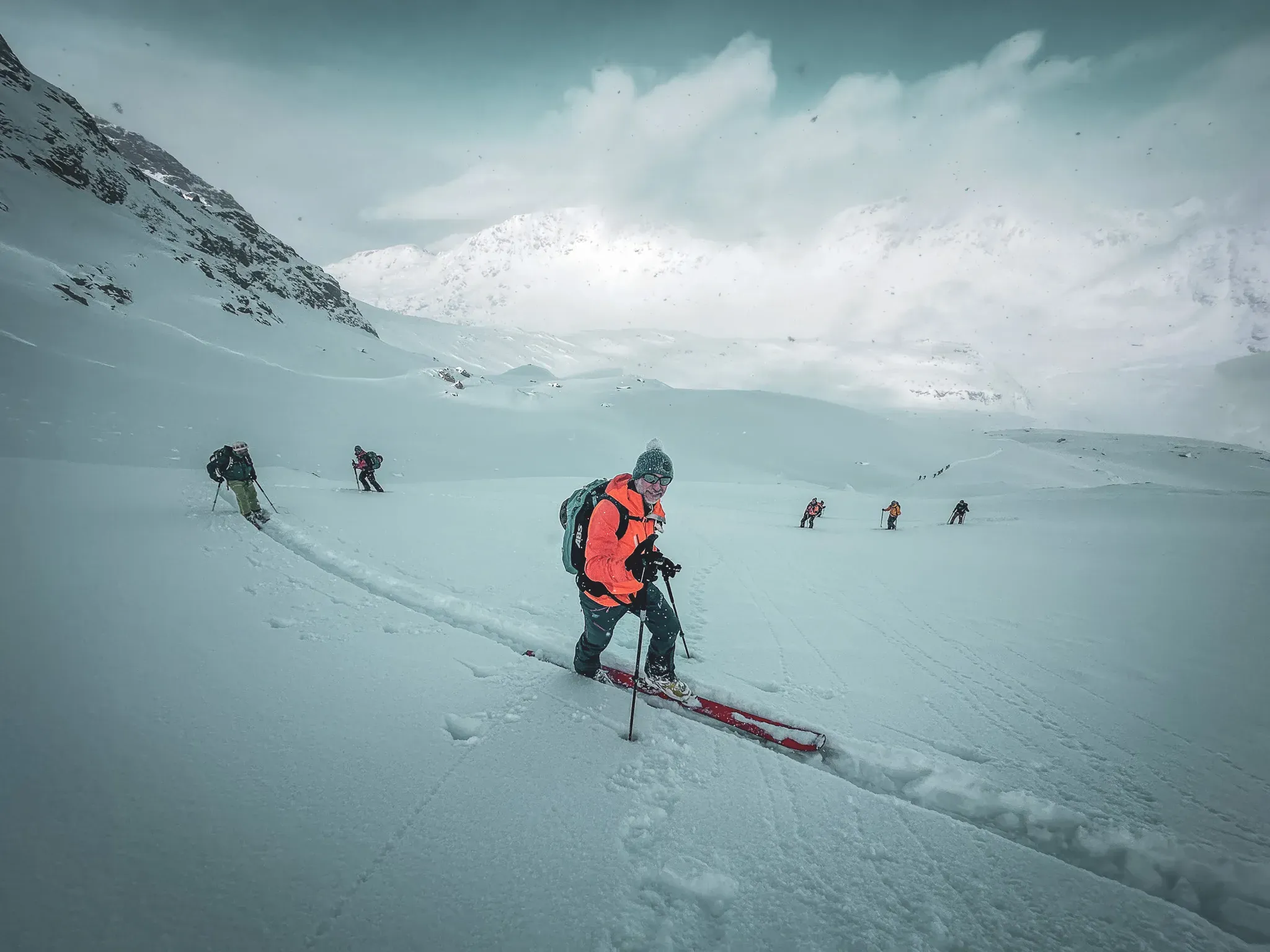 A group of skiers exploring the Lyngen Alps, immaculate snow and majestic scenery.